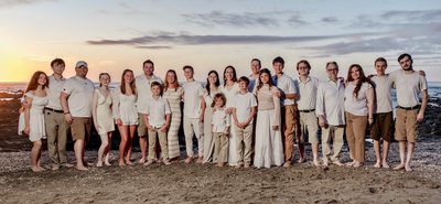 A large family group on the beach at sunset at Johnny's Beach Bungalow, Playa Avellanas, Costa Rica