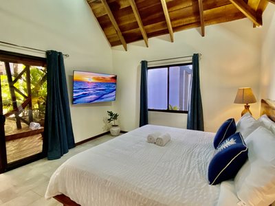 Ocean Suite bedroom with loft at Johnny's Beach Bungalow, Playa Avellanas