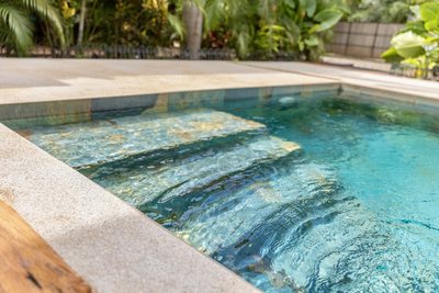 Turquoise pool and deck at Johnny's Beach Bungalow, Playa Avellanas