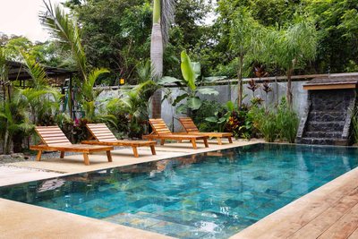 Turquoise pool and deck at Johnny's Beach Bungalow, Playa Avellanas