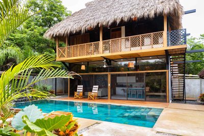 Turquoise pool and deck at Johnny's Beach Bungalow, Playa Avellanas