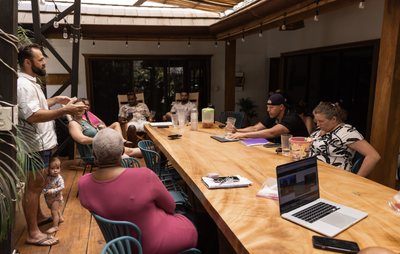 A retreat session around the long table under the covered pavilion at Johnny's Beach Bungalow, Playa Avellanas, Costa Rica