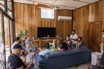 A retreat group with their families in the living room at Johnny's Beach Bungalow, Playa Avellanas, Costa Rica