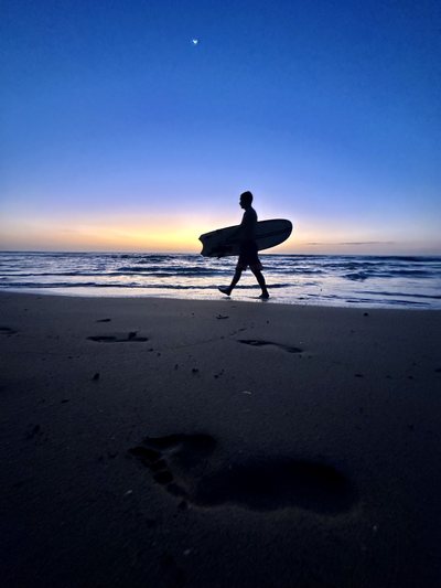 Surfing at Playa Avellanas, Costa Rica