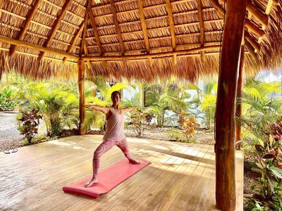 Thatched yoga and massage platform at Johnny's Beach Bungalow