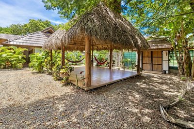 Thatched yoga and massage platform at Johnny's Beach Bungalow